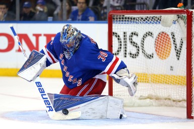 Apr 19, 2016; New York, NY, USA; New York Rangers goalie Henrik Lundqvist (30) makes a save against the Pittsburgh Penguins during the third period of game three of the first round of the 2016 Stanley Cup Playoffs at Madison Square Garden. The Penguins defeated the Rangers 3-1 to take a two games to one lead in the best of seven series. Mandatory Credit: Brad Penner-USA TODAY Sports